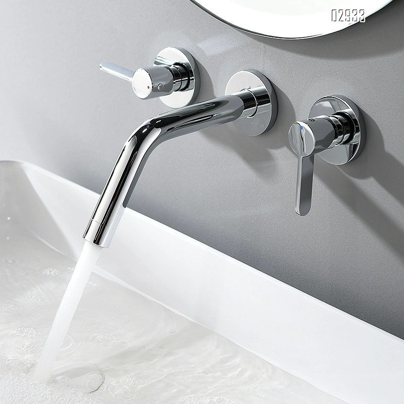 Wall-mounted brass double-handle wash basin faucet for home use with cold and hot water built into the wall of the bathroom