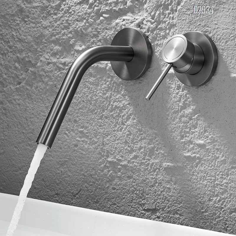 Wall-mounted brass double-handle wash basin faucet for home use with cold and hot water built into the wall of the bathroom